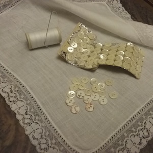Vintage six Mother of Pearl Buttons MOP, Small white shell buttons. Unused and some still on original card. Sold as set of 6 buttons.
