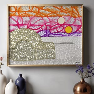 May include: Abstract art print in a gold frame. The artwork features a landscape with a sunset in shades of orange, pink, and purple. A beige structure with white dots is in the foreground. Two moons are in the sky.