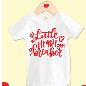 Little Heart Breaker Valentines Day baby bodysuit/one piece with red graphic.