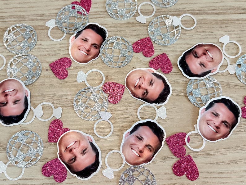 May include: Silver and pink confetti with images of disco balls, rings, hearts, and faces.