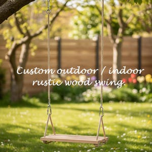 May include: A rustic wooden swing hangs from a tree branch, suspended by rope and metal hardware. The swing's wooden seat is rectangular. The text "Custom outdoor / indoor rustic wood swing" is displayed in white.