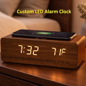 May include: A white ceramic mug with a black handle and the text "But First, Coffee" in a black, handwritten-style font. The mug is on a white surface.