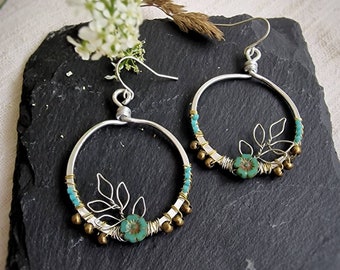 Handmade silver botanical hoop earrings with green, bronze and turquoise beads, wire leaf detail
