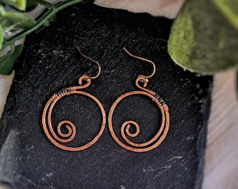 Hammered copper spiral earrings with forest green beads