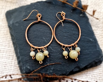 Handmade hammered copper hoop earrings with pale green beads, lightweight, boho