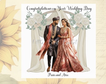 May include: A wedding card featuring a couple in traditional Indian clothing standing beneath a floral arch. The card reads "Congratulations on your Wedding Day" and "Prim and Aria".