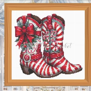 May include: A pair of red and white striped cowboy boots with a candy cane design. The boots are decorated with a red bow and green holly.