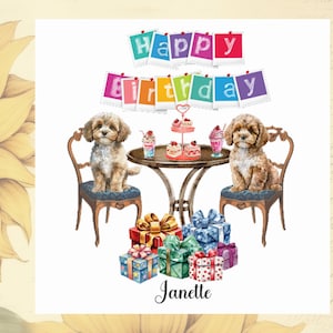 May include: A birthday card featuring two brown and white dogs sitting on chairs at a table with a cake and gifts. The card has a colourful banner that says "Happy Birthday" and the name "Janette" at the bottom.