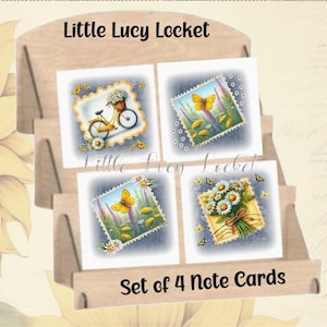 May include: A set of four note cards displayed in a wooden holder. Each card features a postage stamp design with illustrations of a bicycle, butterflies, and flowers. The text "Little Lucy Locket" and "Set of 4 Note Cards" are visible.