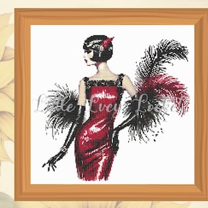 May include: A woman in a red dress with black feathers and gloves. She has short black hair and a red feather in her hair.