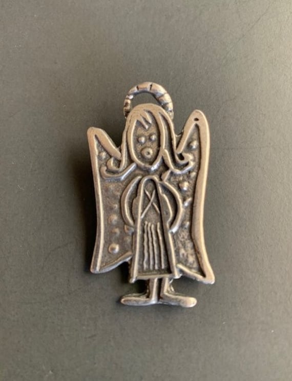 Adorable vintage Christmas angel Pewter angel girl blowing a gold tone trumpet signed Daria designer brooch