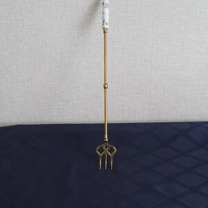 Long brass decorative fork with porcelain decor, roasting fork, fireplace tool.