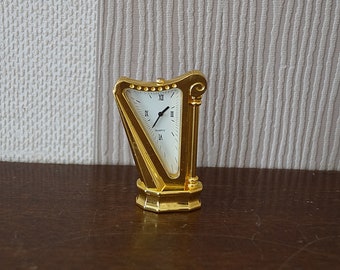 Vintage miniature quartz clock, harp-shaped miniature clock, good working.