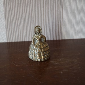 Vintage brass lady bell, hand bell.