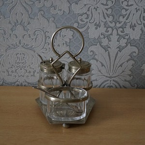 Vintage silver plated cut glass condiment set.