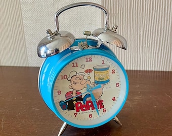Vintage Popeye metal mechanical alarm clock, vintage alarm clock, table clock blue colour.