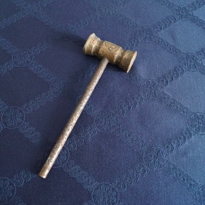Antique copper hummer, old mallet, tool for auctions.