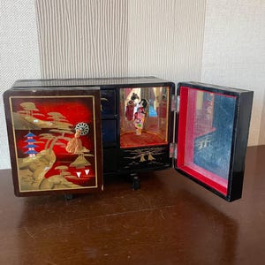 Collectible Vintage Japanese Lacquer Musical Box with Compartments and Whirling Geisha.