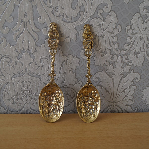 Set of 2 vintage brass spoons.