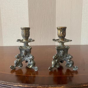 2 Antike Kerzenhalter aus Messing.