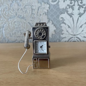 Vintage miniature quartz clock, good working.
