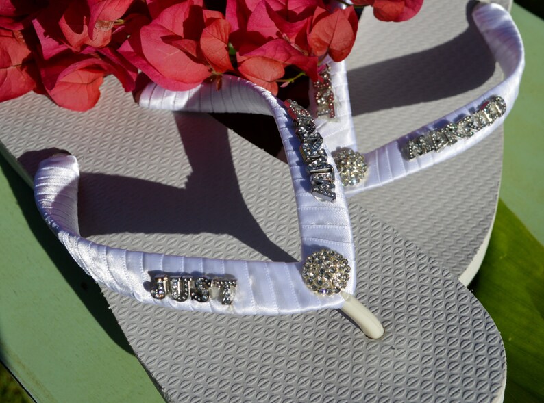 white flip flops with rhinestones