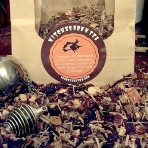 May include: A brown paper bag with a label that reads "Witches Brew Tea" and a witch flying on a broomstick. The label lists the ingredients: Eleuthero, Cinnamon, Hawthorn, Cardamom, Clove, Ginger, and a wisp of Orange. The bag is filled with loose leaf tea.