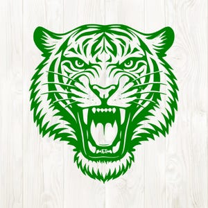 May include: A green tiger head illustration with an open mouth, bared teeth, and detailed stripes. The design features sharp lines and a fierce expression, suitable for various applications.