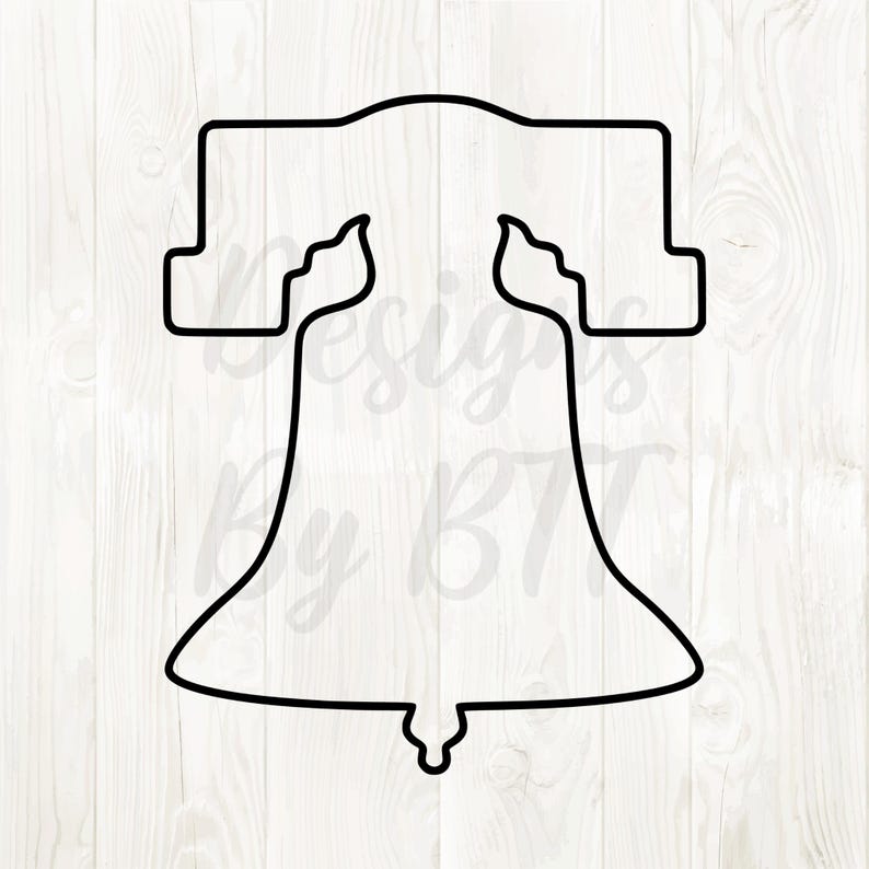 May include: Black outline of the Liberty Bell, a symbol of American independence. The bell shape is clearly defined with its iconic crack and yoke. The design is set against a white wood grain background.