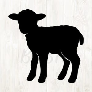 May include: A black silhouette of a lamb standing on four legs. The lamb has a rounded body, small ears, and a fluffy appearance. The background is a light wood grain pattern.