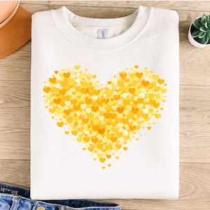 May include: A white ceramic mug with a black handle and the text "But First, Coffee" in a bold, black font. The mug is set against a blurred background, suggesting a cozy setting.