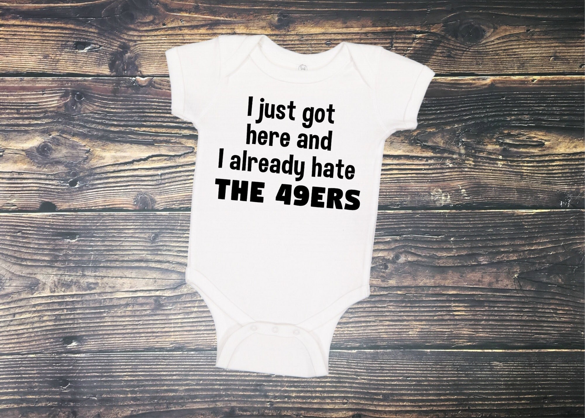 Las Vegas Beat the Odds Baby Onesie designed by JOOLcity