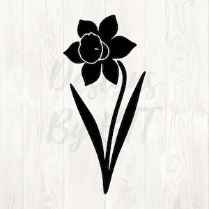 May include: Black and white daffodil flower illustration. The flower has six petals and a trumpet-shaped center. Two long leaves extend from the base of the stem. The image is a simple, elegant design.