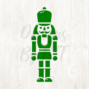 May include: A green nutcracker soldier illustration. The design features a traditional nutcracker with a hat, mustache, and uniform. The image is a vector graphic, perfect for holiday-themed crafts and decorations.