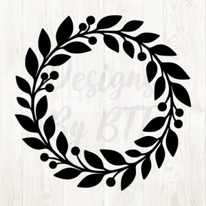 May include: A black wreath design featuring leaves and berries, perfect for crafting projects. The wreath is circular and has a minimalist style. The text "Designs By BT" is faintly visible in the background.
