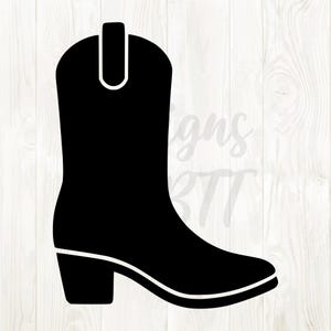 May include: A black cowboy boot silhouette with a white outline. The boot has a pointed toe, a small heel, and a pull tab at the top. The design is set against a white wood grain background.