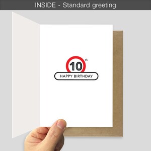 May include: A white greeting card featuring a graphic of the number 10 inside a red circle with the text 10th above a black-outlined rectangle containing the words HAPPY BIRTHDAY. The card is open, revealing the interior design and a brown envelope.