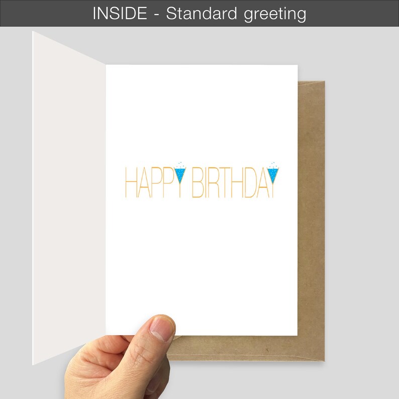 A hand holds the birthday card open showing the standard greeting inside option. The card reads "HAPPY BIRTHDAY" in yellow with the "Y's" as wine glasses in blue. The card is above a recycled brown envelope.
