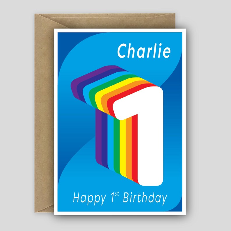 May include: A greeting card with a blue background featuring a large white number one with a rainbow-colored layered effect. The text Charlie is printed at the top and Happy 1st Birthday is printed at the bottom in white sans-serif font.