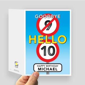 May include: A birthday greeting card with a light blue background featuring two circular red and white road signs. The top sign shows a crossed-out number 9, and the bottom sign shows the number 10. Text reads GOODBYE, HELLO, and HAPPY BIRTHDAY MICHAEL.
