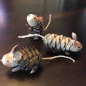 Set of three small pine cone and acorn mice.  Ornaments or table decorations.