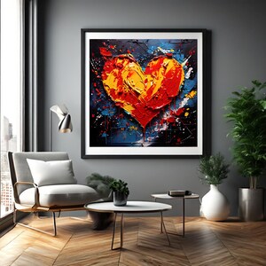 Puede incluir: Una pintura abstracta enmarcada de un corazón rojo y amarillo con un estilo de pintura texturizado. El fondo es negro con salpicaduras azules y blancas.