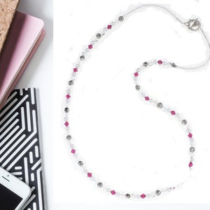 Ruby Birthstone Pearl Necklace makes a perfect handmade gift for women! This beaded birthstone necklace is designed with 6mm gemstone Swarovski crystals, 6-8mm silver beads, 5mm white pearls, 6mm flat round clear beads, and small clear seed beads