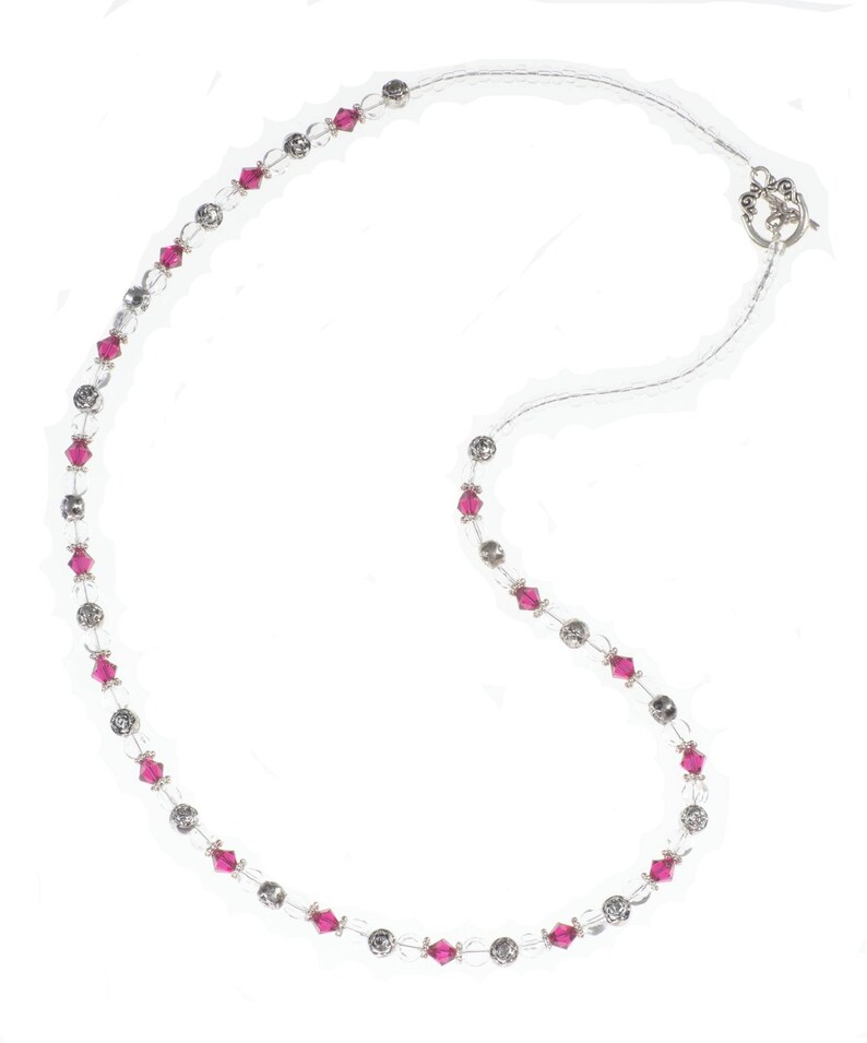 Ruby Birthstone Pearl Necklace makes a perfect handmade gift for women! This beaded birthstone necklace is designed with 6mm gemstone Swarovski crystals, 6-8mm silver beads, 5mm white pearls, 6mm flat round clear beads, and small clear seed beads