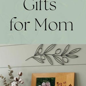 May include: A silver spoon engraved with the text Good morning Grandma, a white note with the same text, a wooden picture frame containing a photo of three children, and a wooden cutting board laser-engraved with a handwritten Irish Soda Bread recipe.