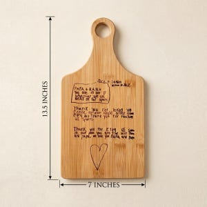 engraved Child's handwriting and drawing on a custom gift for mom cutting laser cutting board