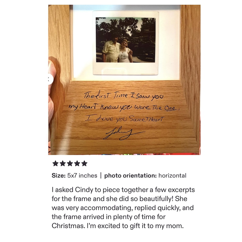 May include: A light-colored wooden picture frame featuring a square photo of two people at the top. The wood is engraved with the text: The first Time I saw you my Heart Knew you were The One, I love you SweetHeart, followed by a signature.