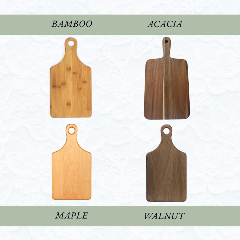 May include: Four rectangular wooden cutting boards with rounded handles and circular hanging holes. The boards are labeled BAMBOO, ACACIA, MAPLE, and WALNUT, showcasing distinct wood grain patterns and natural light to dark brown color variations.