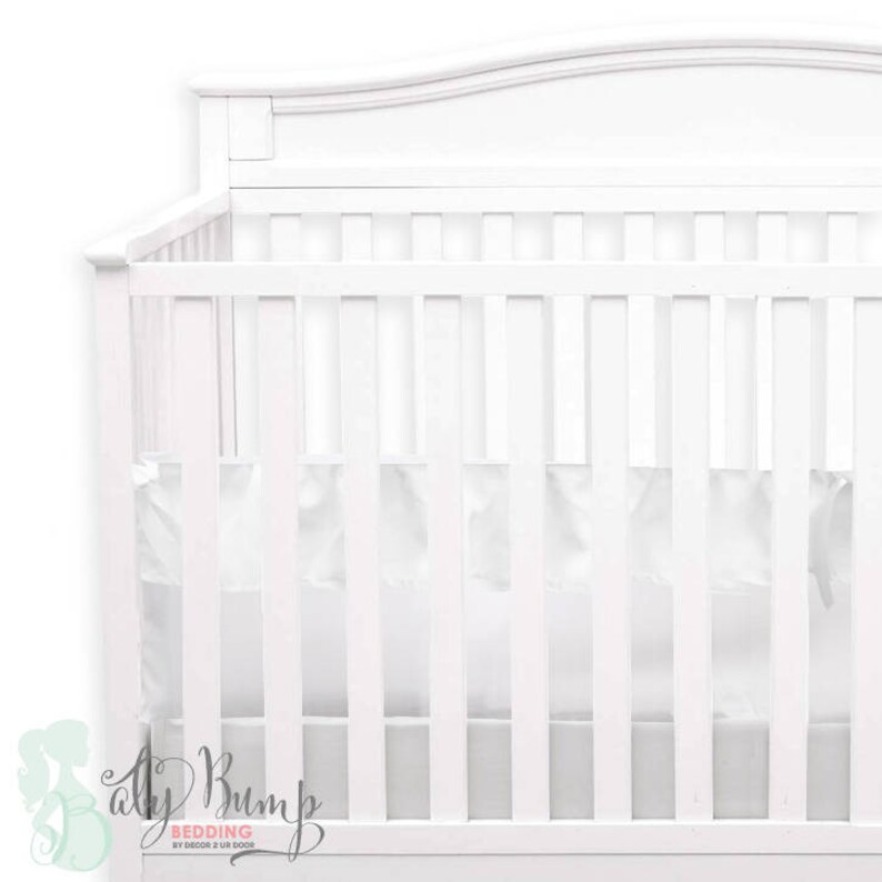 white ruffle crib bumper