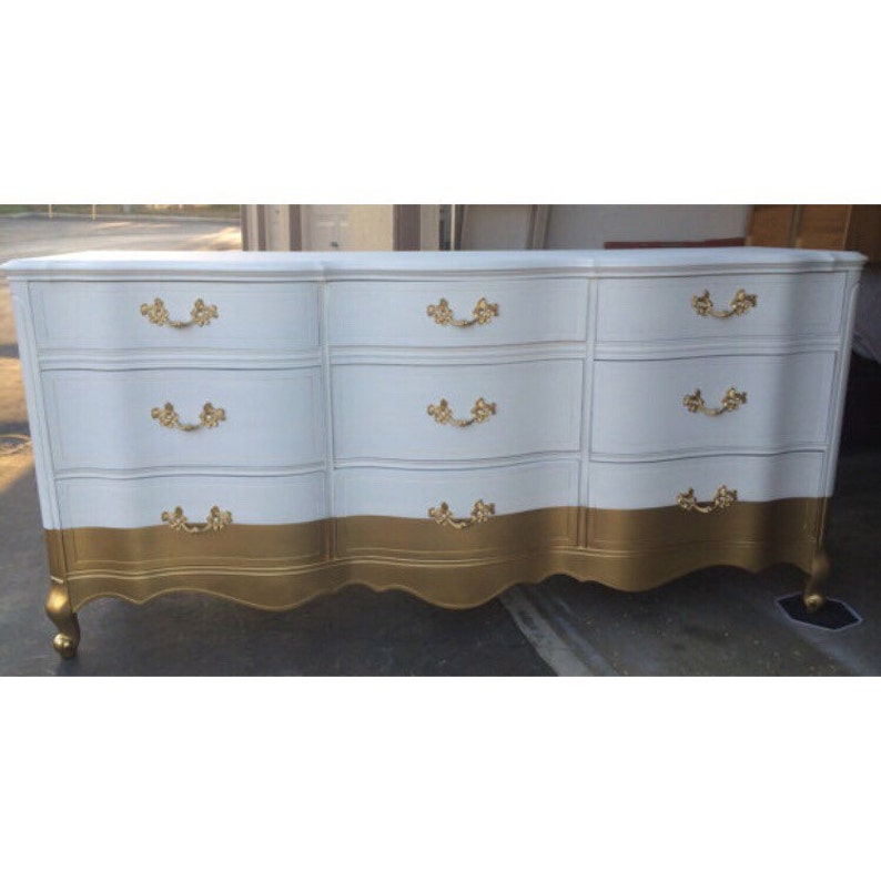 white and gold changing table